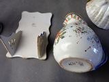a small vase and a pair of scissors on a table