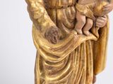 an image of a statue of a person holding a child