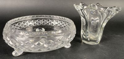 crystal bowl and candle holder on a black surface