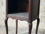 a small wooden table with a drawer on top of it