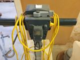 a machine that is sitting on the floor next to a wall