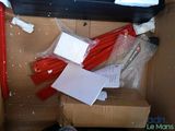 a cardboard box with a bunch of items inside of it