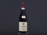 a bottle of wine sitting on top of a table