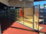 a glass display case in the middle of a store