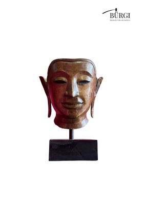 an image of a statue of a person ' s head on a stand