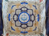 an image of a blue and white square with a clock on it