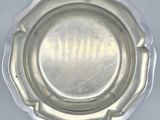 a silver plate that is sitting on a table