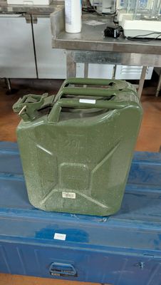 a green plastic container sitting on top of a blue box
