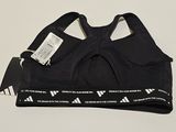 a black sports bra top with a white logo on it
