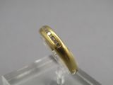 an image of a gold ring with diamonds on a clear surface