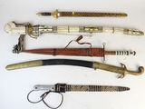 several different types of weapons are displayed on a white surface