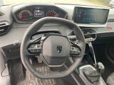 the interior of a car with a steering wheel and dashboard controls