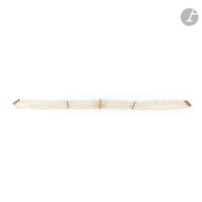 a white bracelet with a gold clasp on a white background