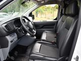 the interior of a white truck with black leather seats and a steering wheel