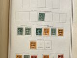 an open book with a bunch of stamps on it