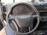 dashboard of a truck with a steering wheel and dashboard controls