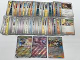 a lot of different pokemon cards on the table