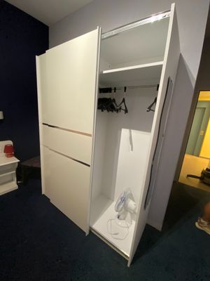 an image of a bedroom with a closet and a bed