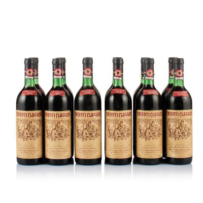 six bottles of wine are lined up on a white surface