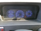 a close up of a car dashboard with a speedometer