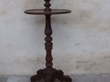 a wooden table with three tiered trays on it