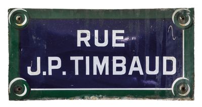 a blue and white sign that says rue up timbaud
