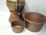 three pots and a bowl sitting on a white surface