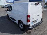 a white van that is parked in a parking lot