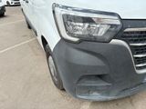 the front of a white van parked in a parking lot