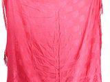 pink scarf with fringes hanging on a white wall