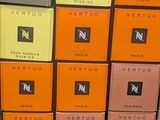 several boxes of perfumes are stacked on top of each other in a store