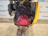 the engine of a small engine is sitting on the ground