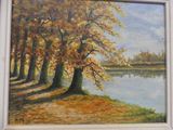 an oil painting of trees by a river in a white frame