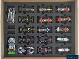 a box with a lot of toy cars in it