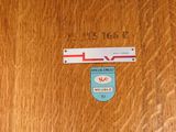 a wooden door with a sign on it and a sticker on the door
