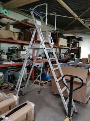 a ladder that is sitting in the middle of a room