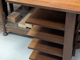 a wooden desk with a drawer on top of it