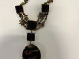 a necklace that has a picture of a woman on it