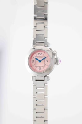 an image of a woman ' s wrist watch with a pink dial