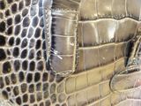 a close up of a purse with a metal buckle
