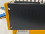 a yellow and black box with a bunch of knives in it
