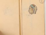 an old book with a drawing of a woman ' s head on it