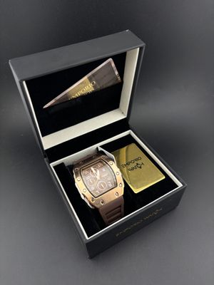 two watches in a box with a lighter and a lighter lighter