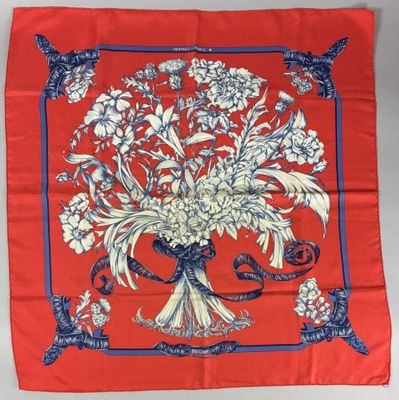 an image of a red scarf with a bouquet of flowers on it
