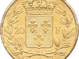 a close up of a gold coin with a crown on it