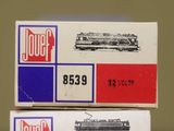 two boxes that are stacked on top of each other