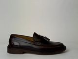 men ' s black leather loafers with tassels on the sole