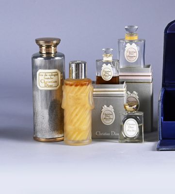 many different types of perfumes in a display case