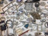 many different types of jewelry on a table
