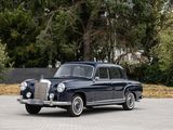 a vintage car that is parked in a parking lot
